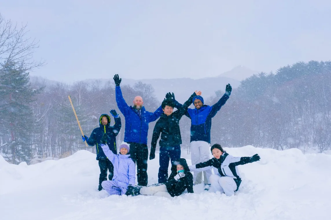 Students and staff in the snow at Harrow Appi Japan
