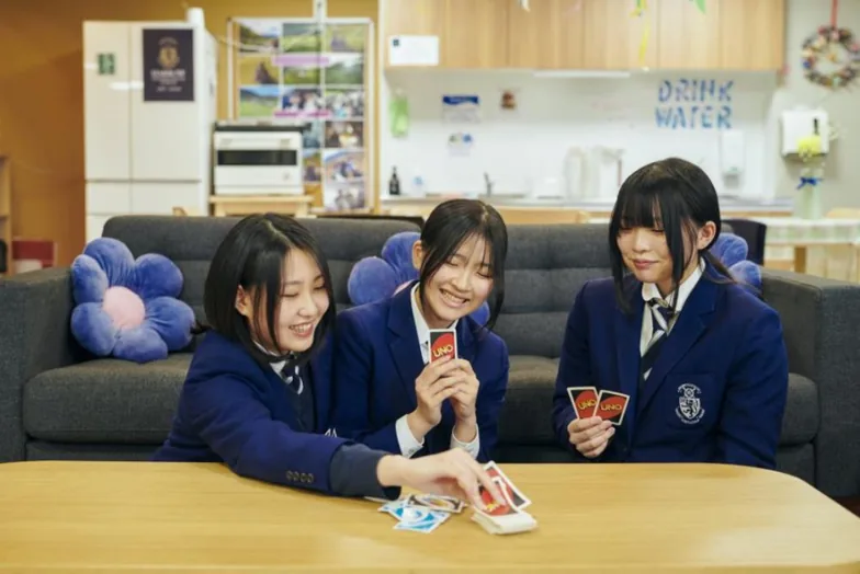 Students playing cards in the boarding house