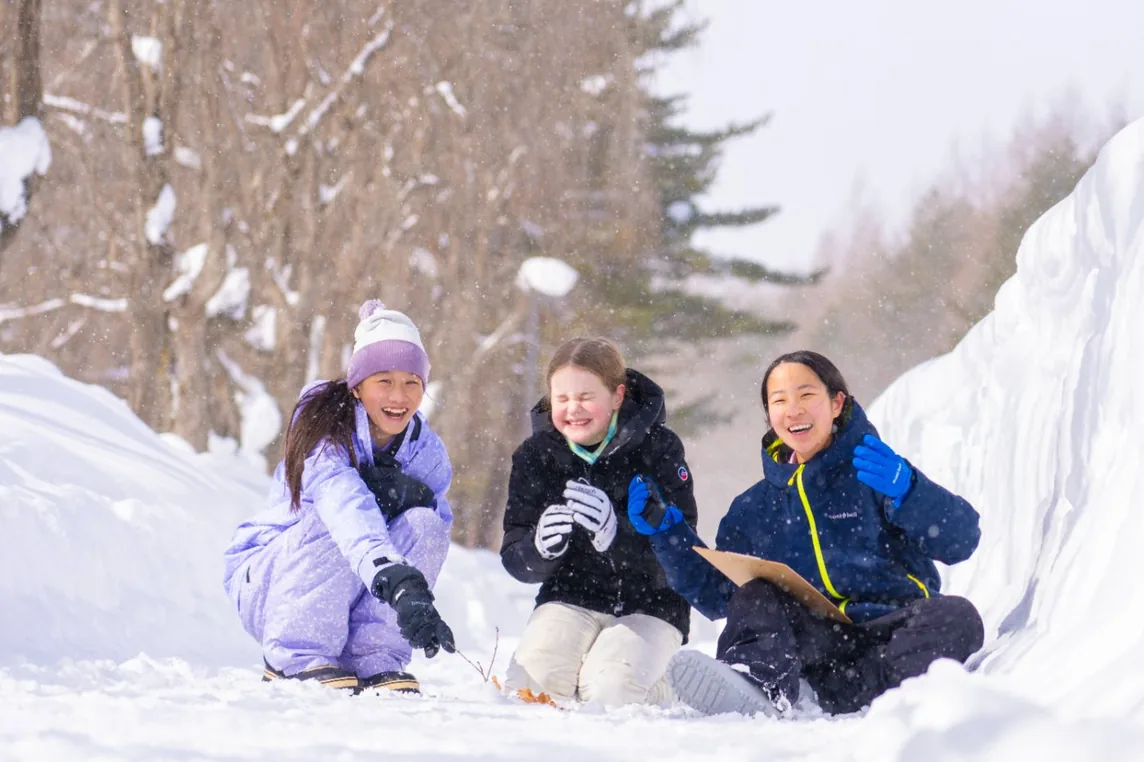 Students working outside in the snow